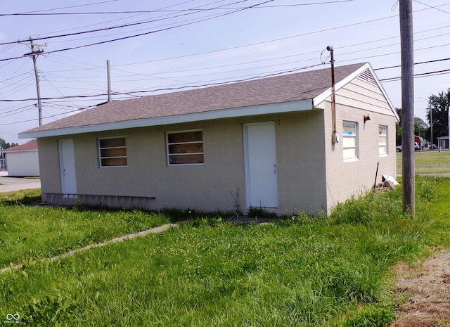 rear view of house with a lawn