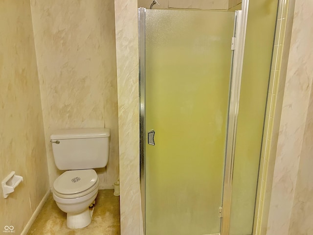 bathroom with toilet and an enclosed shower