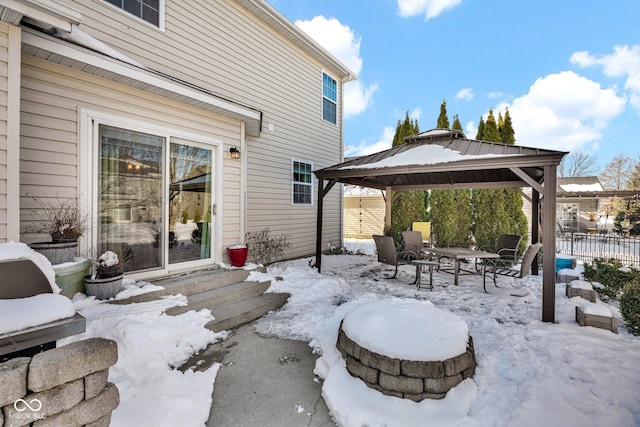 snow covered patio with a gazebo