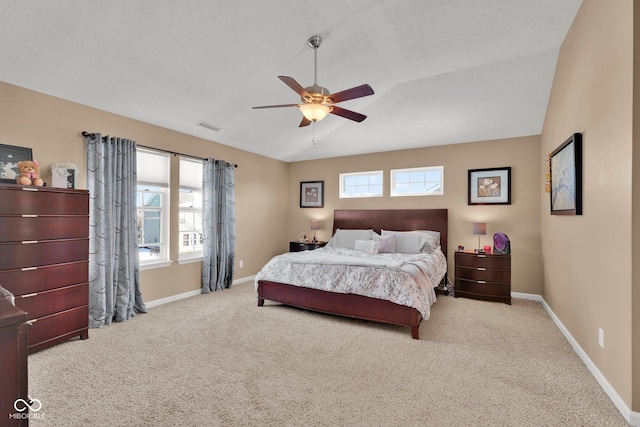 bedroom featuring vaulted ceiling, ceiling fan, and light colored carpet