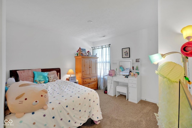 carpeted bedroom featuring a textured ceiling