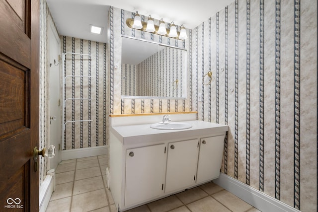 bathroom with tile patterned floors and vanity