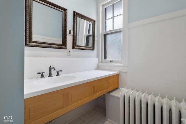 bathroom featuring vanity and radiator heating unit