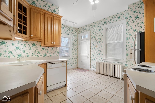 kitchen with light tile patterned floors, ceiling fan, white appliances, track lighting, and radiator