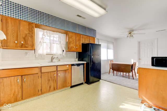 kitchen with sink, backsplash, black appliances, and ceiling fan