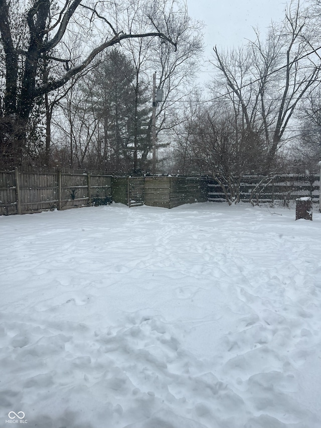 view of yard covered in snow