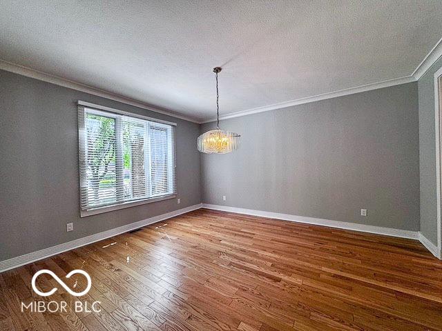 13650 Golden Ridge Ln, Fishers, IN 46055 - unfurnished room featuring crown molding and wood finished floors