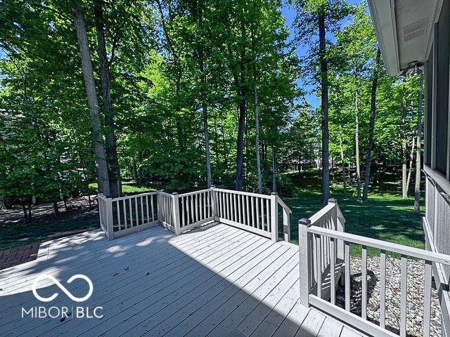 13650 Golden Ridge Ln, Fishers, IN 46055 - wooden terrace featuring view of wooded area