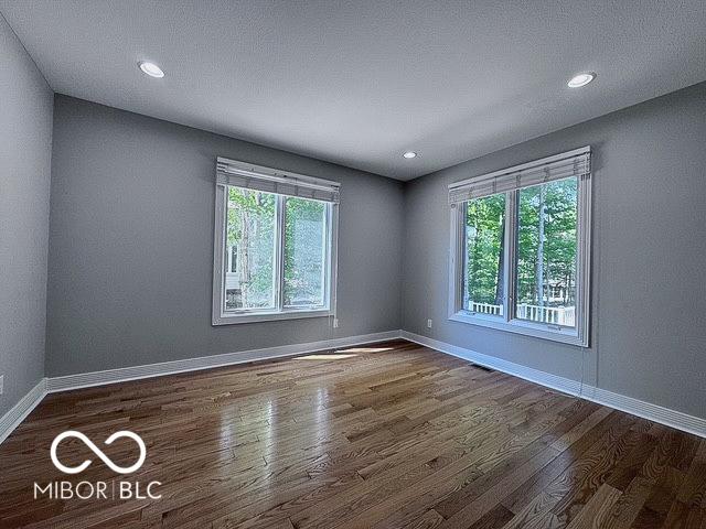 13650 Golden Ridge Ln, Fishers, IN 46055 - empty room with wood finished floors and recessed lighting