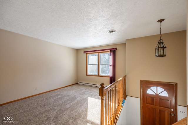 entrance foyer featuring carpet, a baseboard radiator, and a textured ceiling