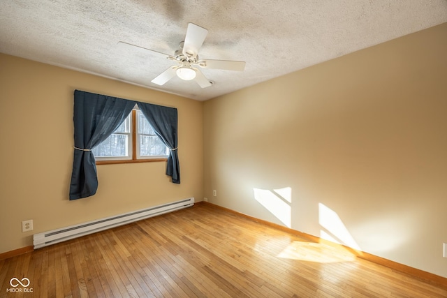 unfurnished room with ceiling fan, hardwood / wood-style flooring, a textured ceiling, and a baseboard heating unit