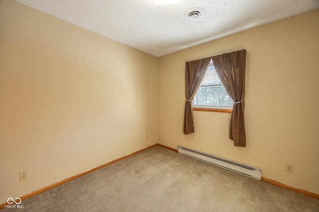 carpeted spare room featuring a textured ceiling and a baseboard heating unit