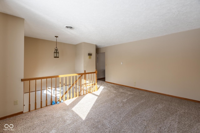 spare room featuring carpet floors