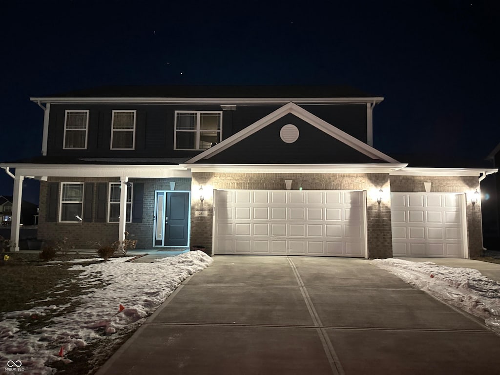 view of front of property with a garage