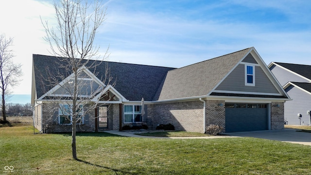 craftsman-style house featuring a garage and a front yard