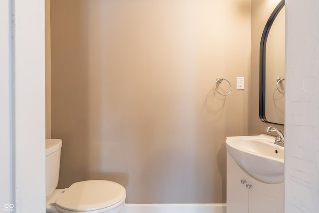 bathroom with toilet and vanity