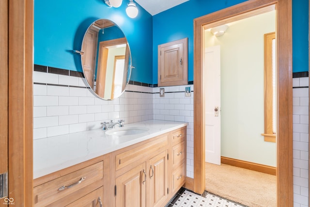 bathroom with tile walls and vanity