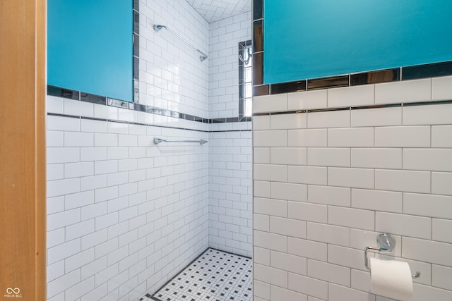 bathroom with a tile shower