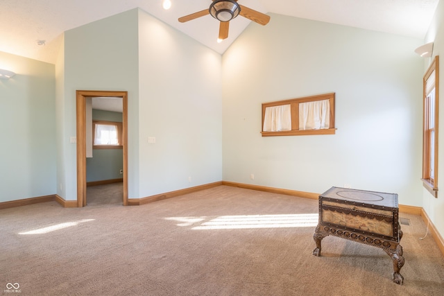 living room featuring high vaulted ceiling, ceiling fan, and carpet