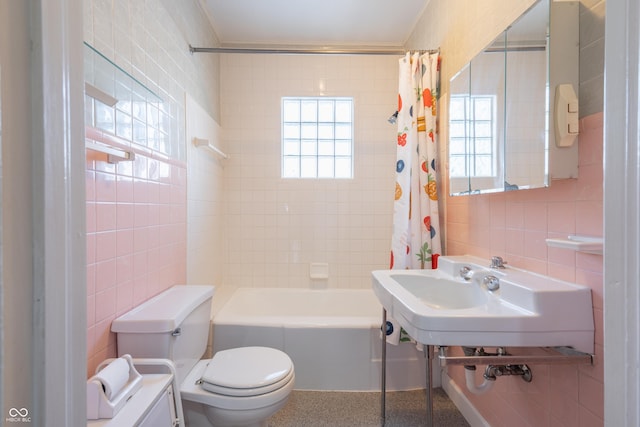 full bathroom featuring toilet, tasteful backsplash, tile walls, shower / bath combination with curtain, and sink