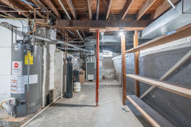 basement featuring heating unit and gas water heater