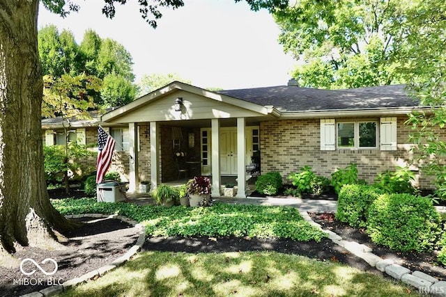 ranch-style home with covered porch