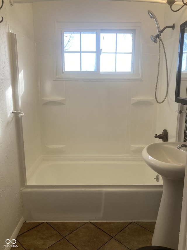 bathroom featuring sink, tile patterned floors, a wealth of natural light, and  shower combination