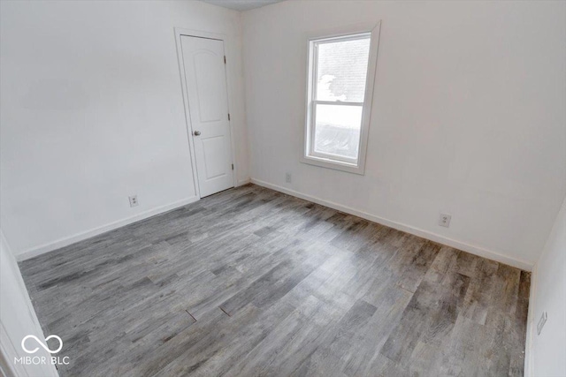 empty room featuring hardwood / wood-style flooring