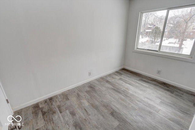 spare room with light hardwood / wood-style floors