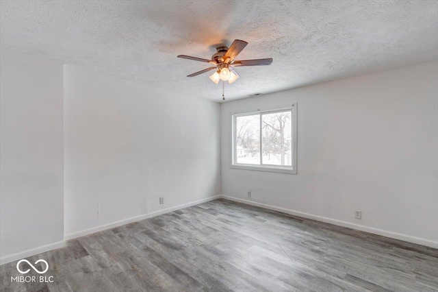 unfurnished room featuring ceiling fan, a textured ceiling, and light hardwood / wood-style flooring