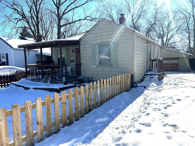 view of front of property featuring a porch and a garage