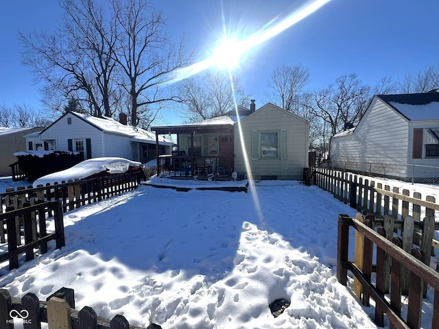 snow covered property featuring a porch