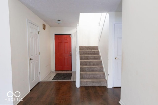 staircase with wood-type flooring