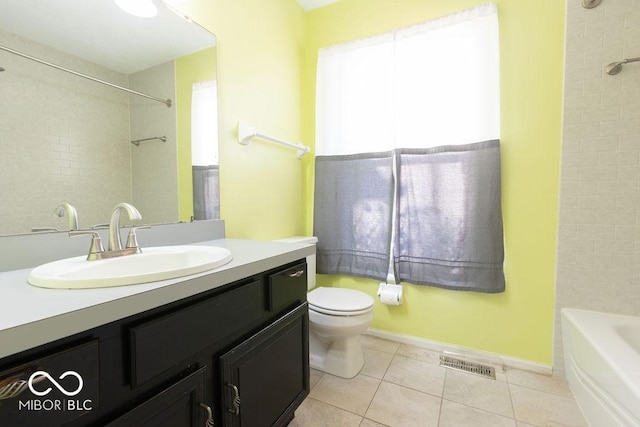 full bathroom with vanity, toilet, tiled shower / bath combo, and tile patterned flooring