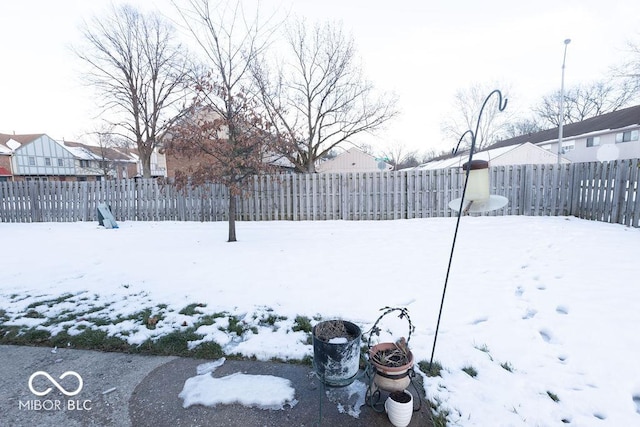 view of yard layered in snow