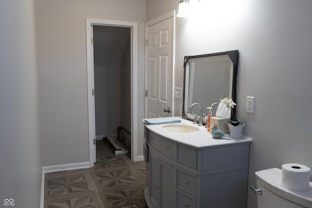 bathroom with toilet and vanity