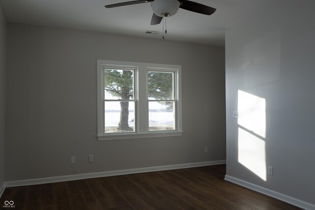 unfurnished room featuring ceiling fan and dark hardwood / wood-style floors