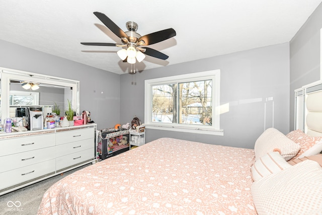 bedroom featuring ceiling fan and carpet floors