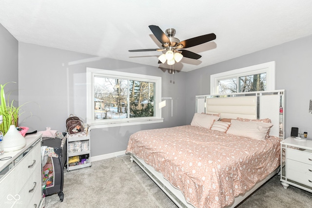 bedroom with light carpet and ceiling fan