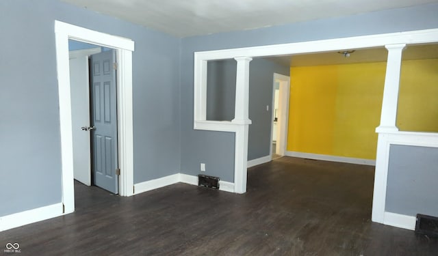 empty room with dark wood-type flooring