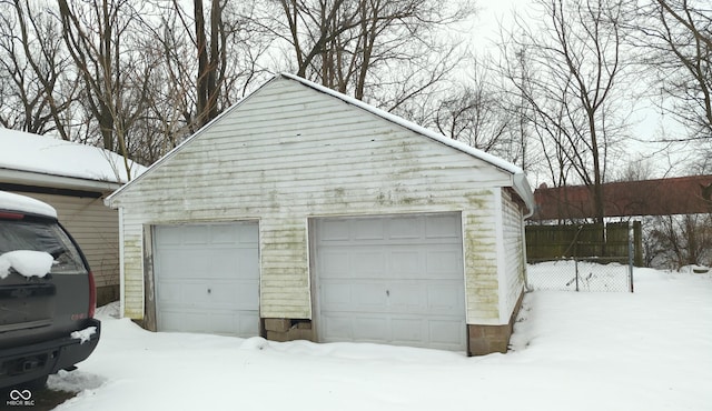 view of snow covered garage