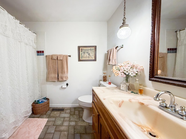 bathroom with toilet and vanity