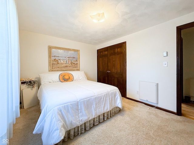 carpeted bedroom with a closet