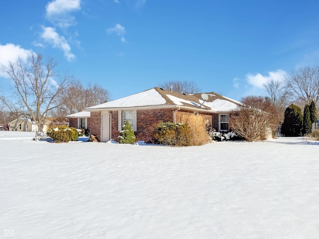 view of snow covered property