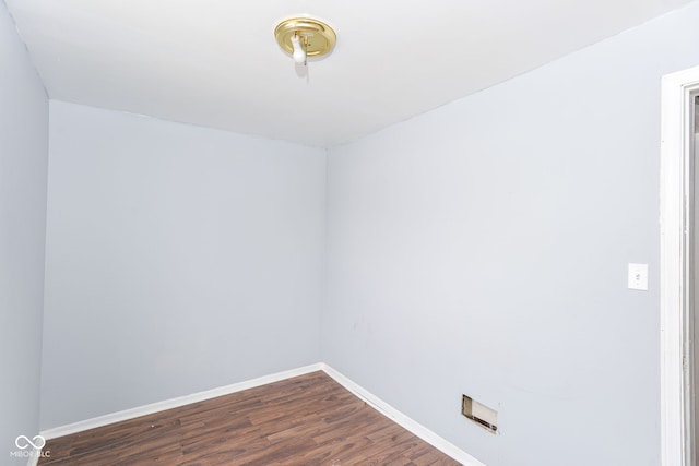 empty room with dark wood-type flooring