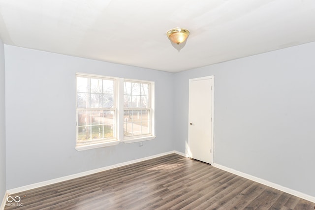 empty room featuring dark hardwood / wood-style floors