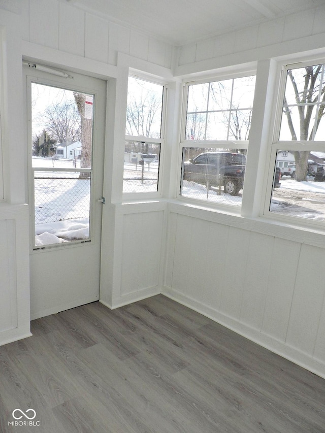 unfurnished sunroom with a healthy amount of sunlight