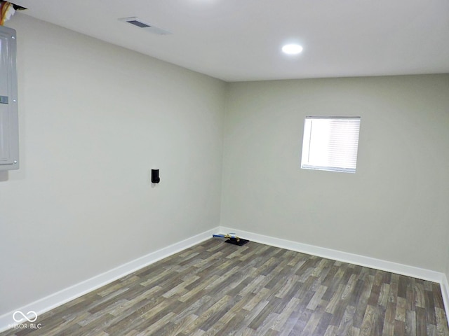 empty room with dark hardwood / wood-style floors