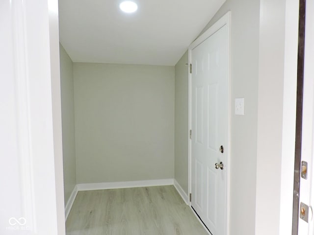 hallway with light hardwood / wood-style flooring