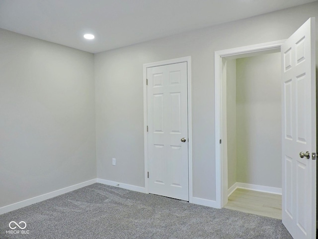 unfurnished bedroom with light colored carpet